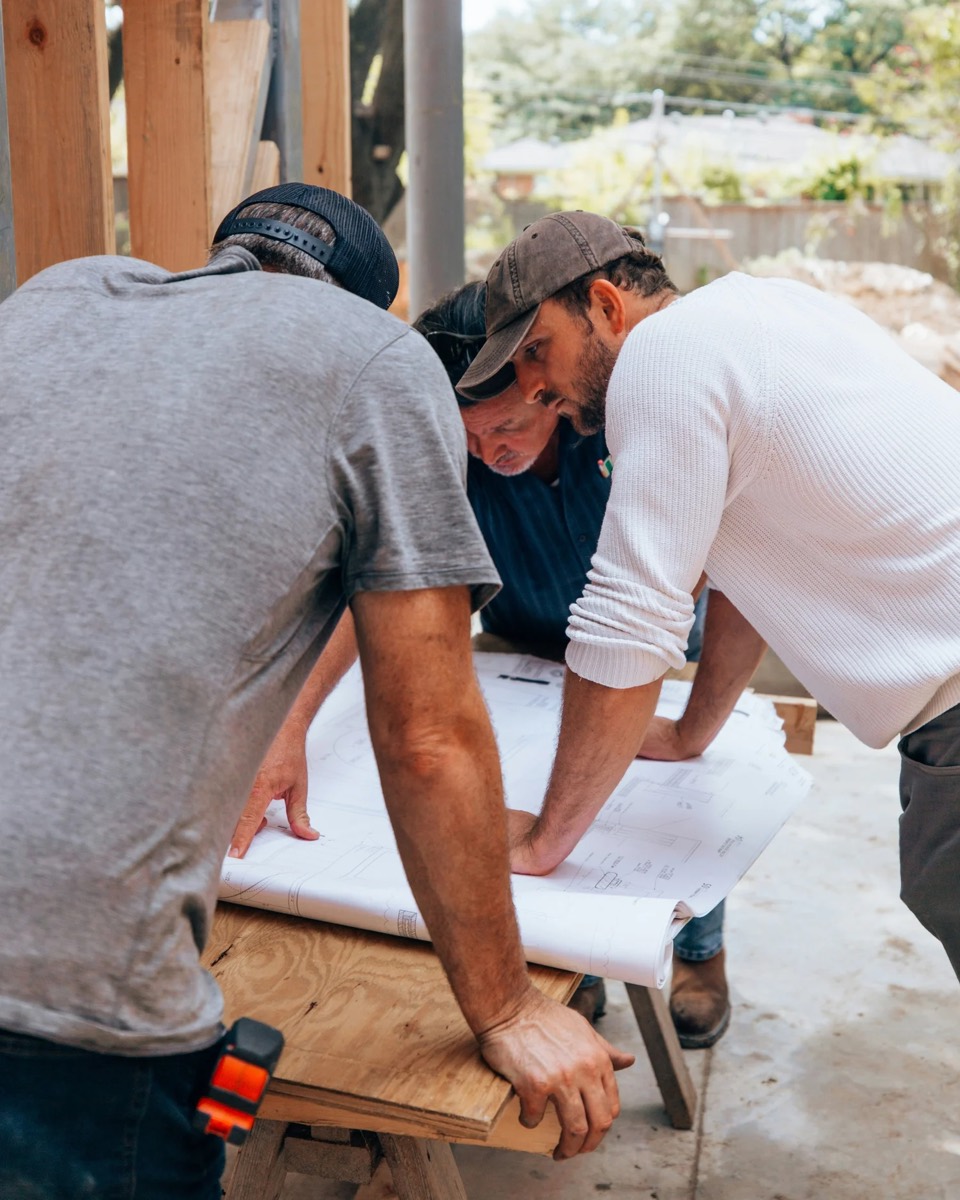 Rocksolid team reviewing plans on site